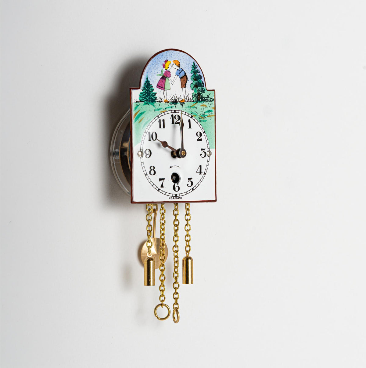 Wanduhr "Bub und Mädle", Bogenschild aus Emaille, Maße: 50 x 75 mm, Eintagewerk