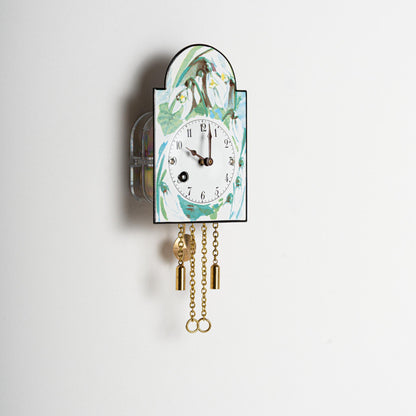 Wanduhr "Schneeglöckchen", Bogenschild aus Emaille, Maße: 100 x 65 mm, Siebentagewerk