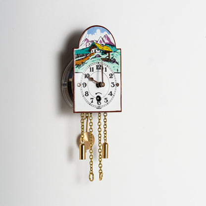 Wanduhr "Alpenhaus",  Bogenschild aus Emaille, Maße: 50 x 75 mm, Eintagewerk