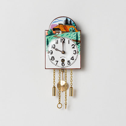 Wanduhr "Schwarzwaldhaus",  Bogenschild aus Emaille, Maße: 50 x 75 mm, Eintagewerk
