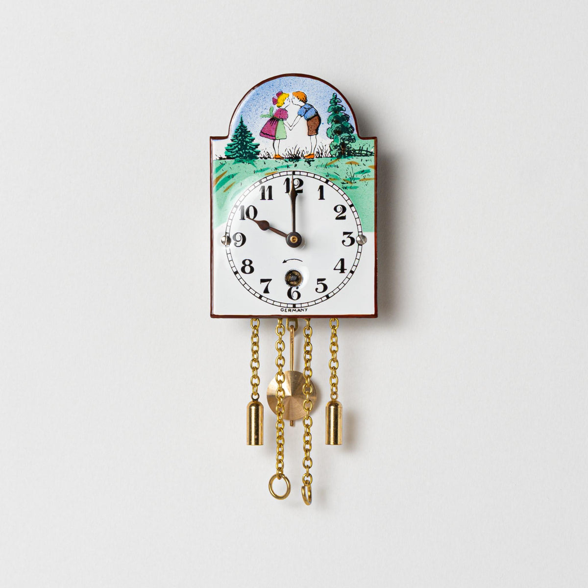 Wanduhr "Bub und Mädle",  Bogenschild aus Emaille, Maße: 50 x 75 mm, Eintagewerk
