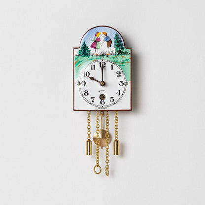Wanduhr "Bub und Mädle",  Bogenschild aus Emaille, Maße: 50 x 75 mm, Eintagewerk